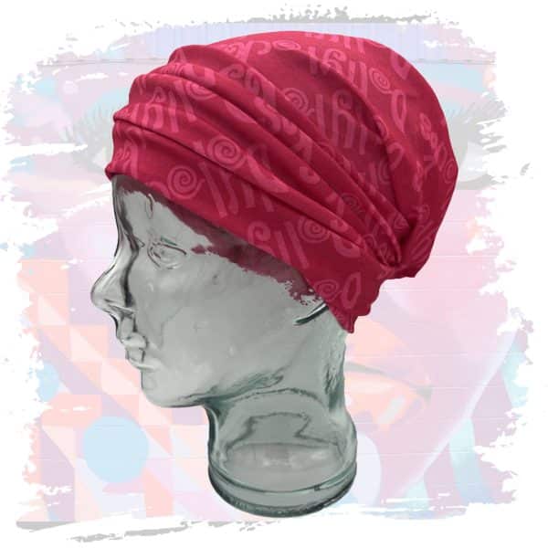 a glass head with a red scarf on it