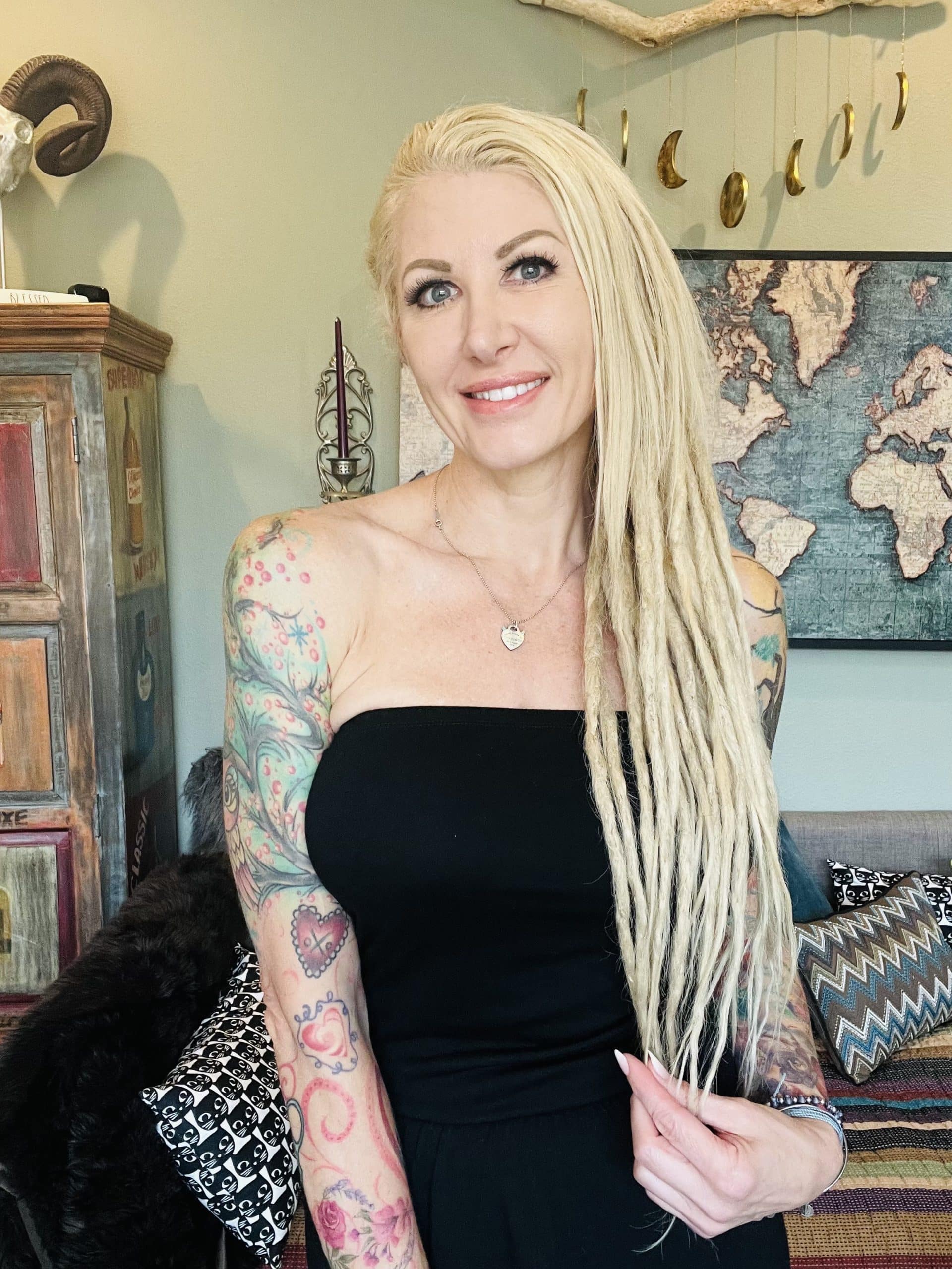 a woman with blonde hair and tattoos